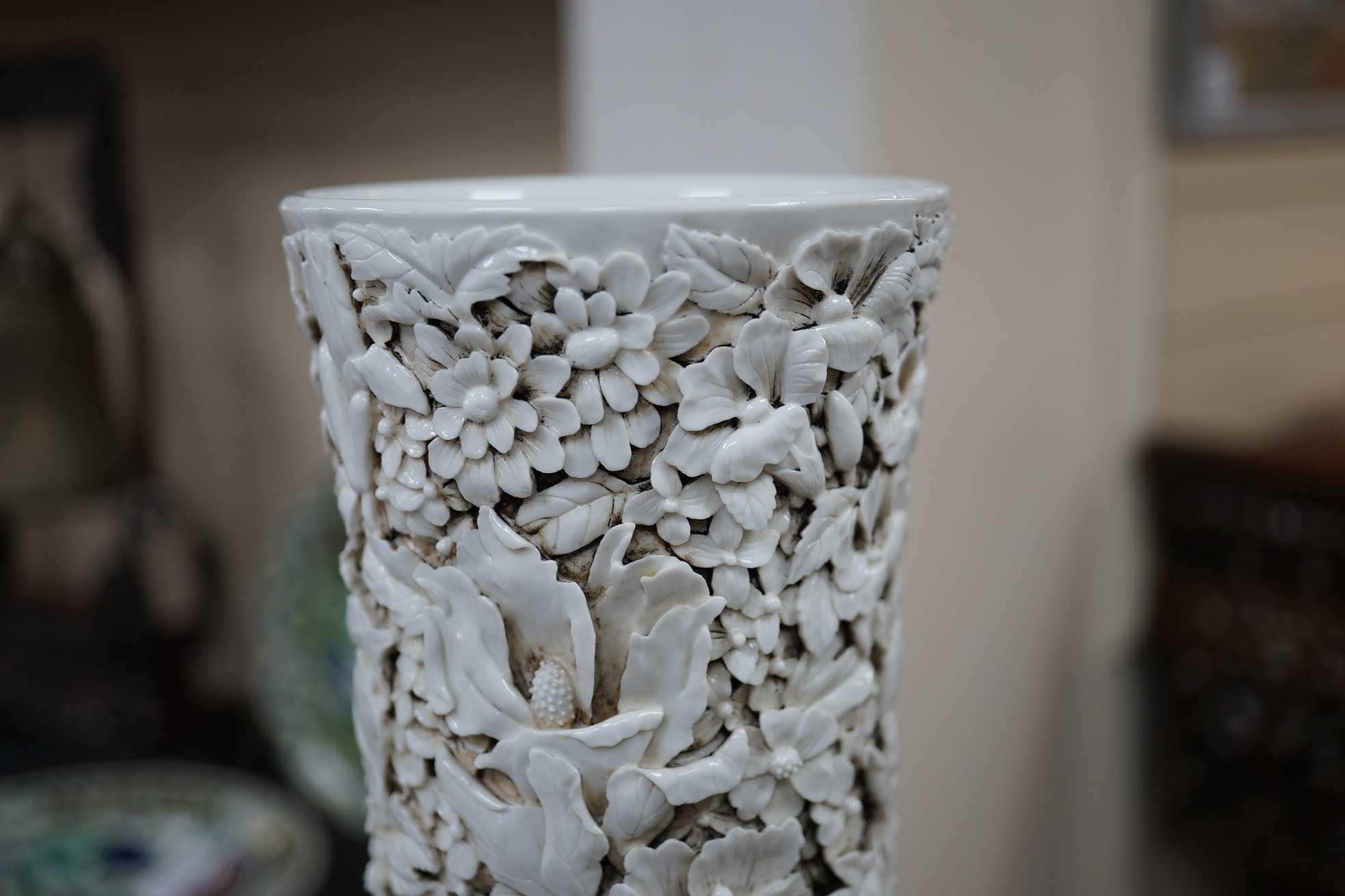 A large Chinese carved porcelain ‘thousand flower’ bottle vase, 20th century